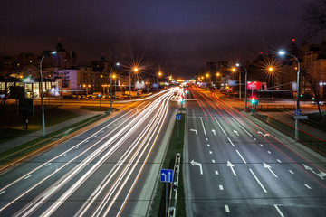 Fototapeta na wymiar Long Exposure abstract urban background - Speed Traffic at Sundown Time - light trails on motorway highway at night, fantastic sky