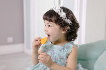 Little pretty Asian girl dressing as princess laughing portrait, healthy and happy lifestyle.