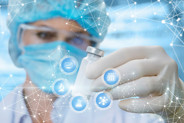 A doctor is looking at the capsul with some medicine inside in her hand surrounded by icons with...