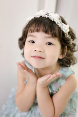 Little pretty Asian girl dressing as princess laughing portrait, healthy and happy lifestyle..