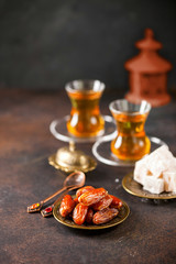 Dried dates and tea in the glasses