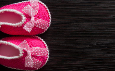 Baby clothes on wooden background