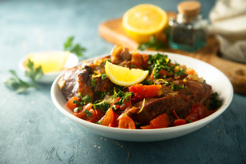 Traditional Italian Ossobuco with lemon and parsley sauce