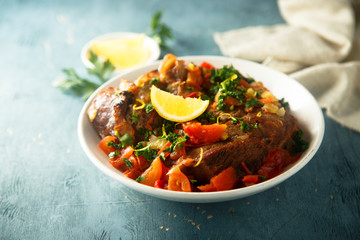 Traditional Italian Ossobuco with lemon and parsley sauce