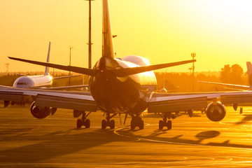 Fototapeta na wymiar aircraft in airport at sunset
