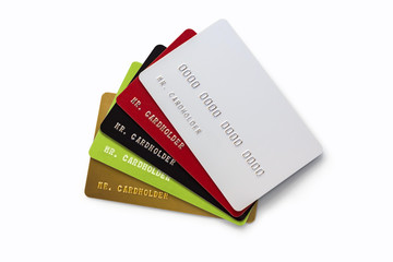 Stack of multicolored credit cards isolated on white background