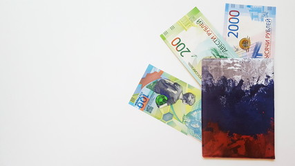 Two Russian banknotes are in the passport cover, painted in the colors of the Russian flag