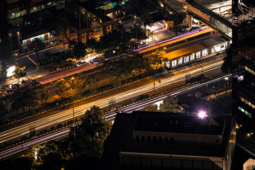 Fototapeta na wymiar Long exposure looking down at the streets of Jakarta Indonesia at night with traffic.