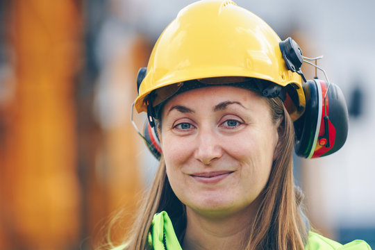 Portrait Of Woman In Construction Safety Clothing At Work Site