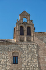 Fototapeta na wymiar Ventana y campanario/ fachada con ventana y campanario del ayuntamiento de Torrijos, provincia de Toledo. Castilla-La Mancha. España