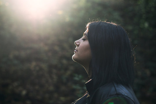 Girl with closed eyes kissed by the sunlight