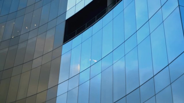 Modern round office building with windows.