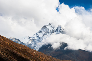 Peak of Mount Ama Dablam in the clouds, Himalayas, Nepal.