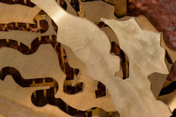 yellow metal from brass. remnants of brass processing after punching. Textural background. brass details