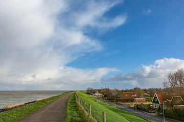 Fototapeta na wymiar landscape with road, dam ,sea, and clouds