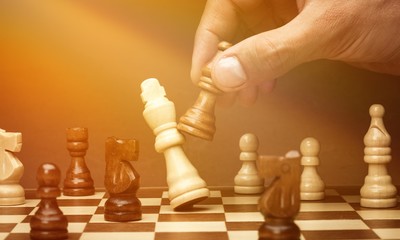 Businessman playing chess close up