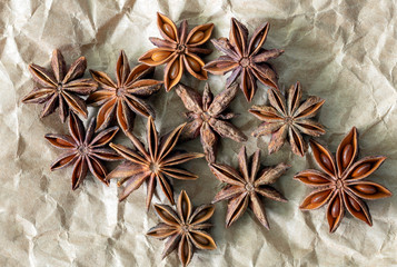 Bulk star anise spice on brown paper