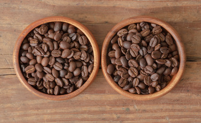 Coffee beans in wood bowls.
