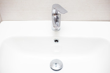 Close-up of ceramic white bathroom sink