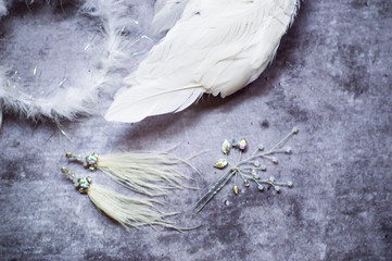 Accessories for accessories for parties on February 14: the image of an angel lbi, wings, a nimbus, earrings from ostrich feathers, a cristavo stud. Flat lay, top view, copy space, square