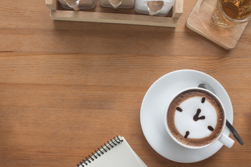 Copy space of table on coffee's shop with a latte cup design for made menu background