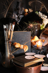 Black candle Magic Ritual. Antique Magic Book. Witchcraft  Peacock feathers and candle background.