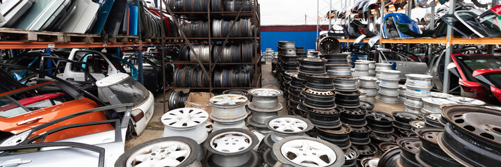 Auto parts market. Car wheels are on the ground.