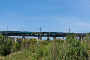Fototapeta na wymiar Freight train on bridge