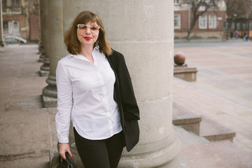 business woman with phone walk in the city