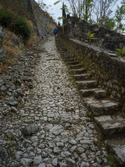 Obraz premium Stone path leading towards Kotor Fortress, Kotor, Bay of Kotor, Montenegro