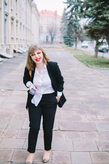 Business Women Style. Woman Going To Work Walking Downstairs. Portrait Of Beautiful Smiling Female In Stylish Office Clothes Going Old Town.