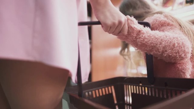 Close-up of the basket that mom keeps with her little daughter in the mall