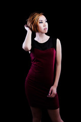 Slender Asian American Woman Standing In Red Dress