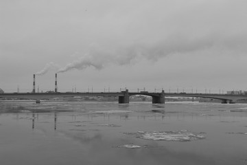 black and white cityscape with freezing river