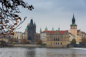Naklejka premium Gothic tower of Charles' bridge over the river Vltava and Nove Mesto, Prague, Czech republic