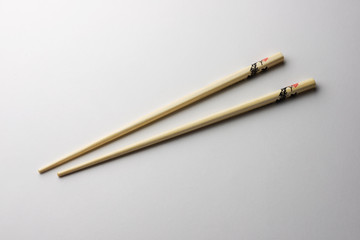 Rice chopsticks decorated on a white background