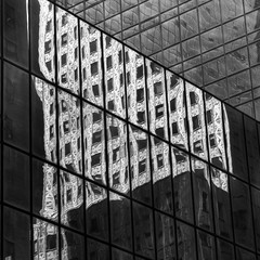Reflection of skyscraper on the glass of another building, Socony-Mobil Building, 42nd Street,...