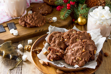 Baked Christmas cookies. Homemade Chocolate Chip Cookies with Nuts on a wooden table.