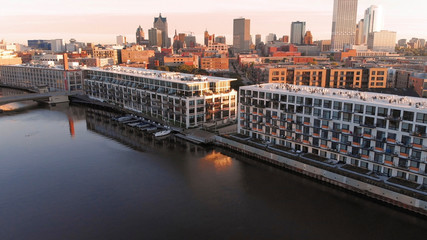 Obraz premium Milwaukee river in downtown, harbor districts of Milwaukee, Wisconsin, United States. Real estate, condos in downtown. Aerial view, drone flying