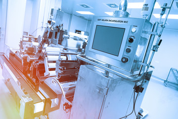 big steel machine with shafts and control panel