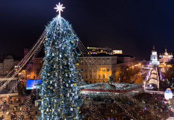 Christmas tree decorated with lights and Sophia Cathedral on background. Kiev, Ukraine