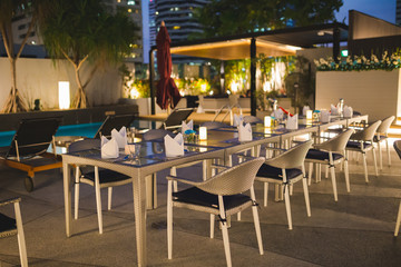 tables and chairs in cafe set up for dinner party