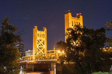 Night view of the Tower Bridge connecting Sacramento to West Sacramento; downtown area skyline visible in the background; California