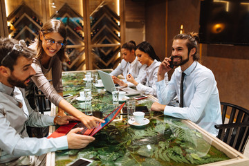 Young business people meeting at a cafe