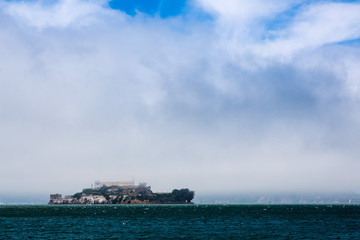 Island With Fog and Clouds