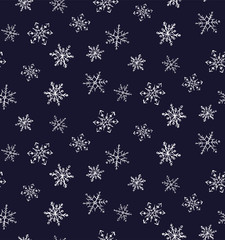 Seamless pattern sketches of white snowflakes on a dark background.
