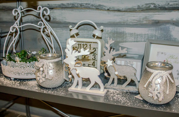 christmas gifts: wooden reindeers,  candles and other souvenirs and sparkles in the shop