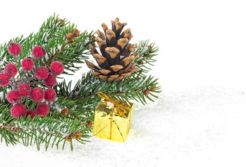 Christmas decorations on white background. Fir tree branch with decoration in snow.