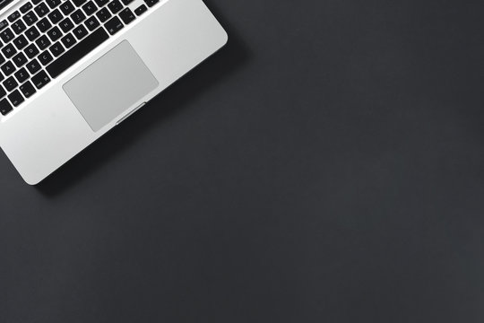 Top View Laptop on black background copyspace textspace