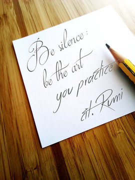 White note paper with a sentence from Rumi